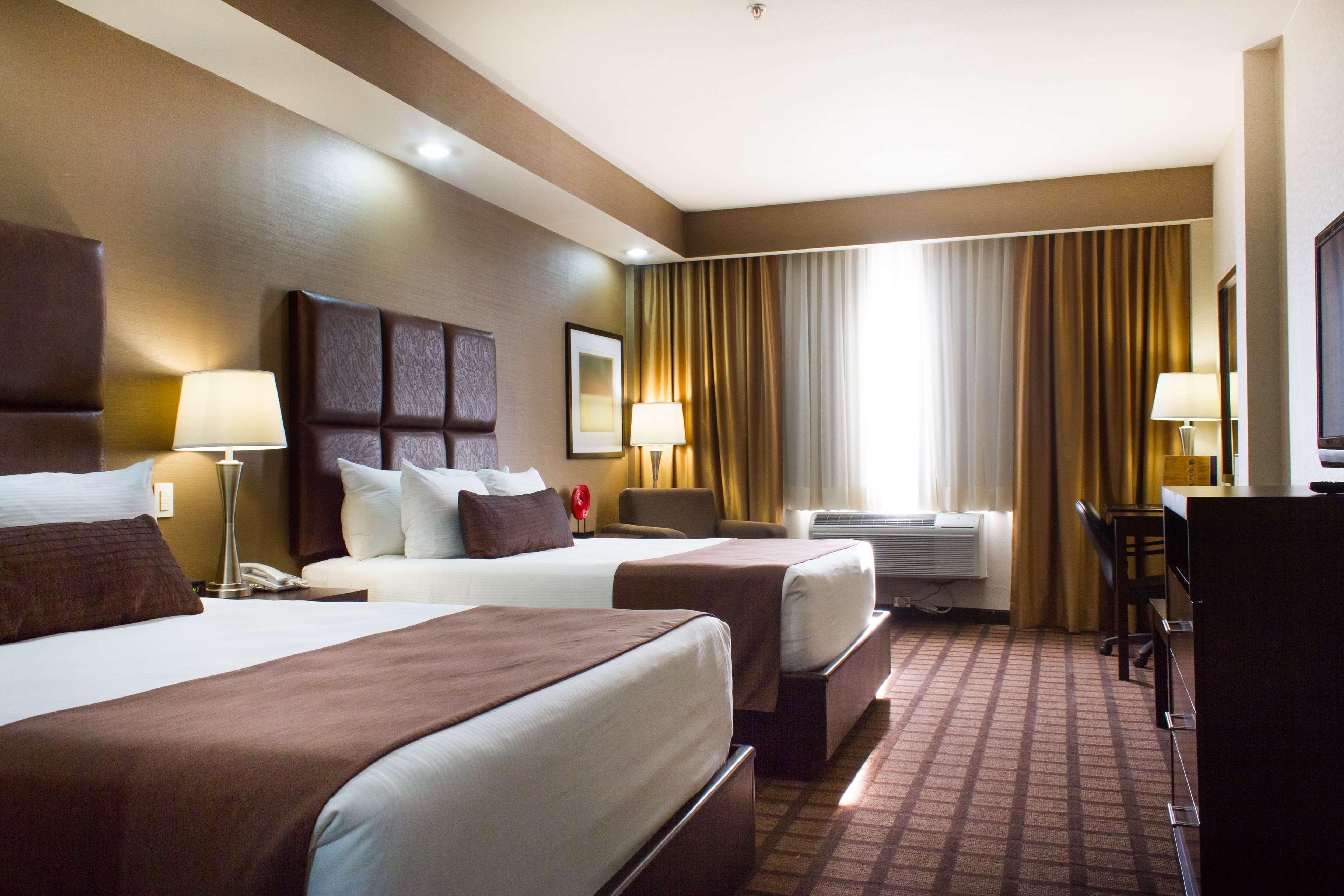 Best Western Premier Monterrey Aeropuerto Apodaca Bagian luar foto A typical hotel room